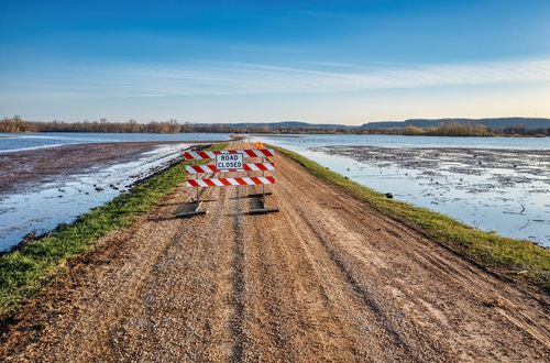 a roadblock sign on an empty road